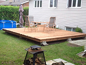 Patio en bois traité - Construire un patio au sol